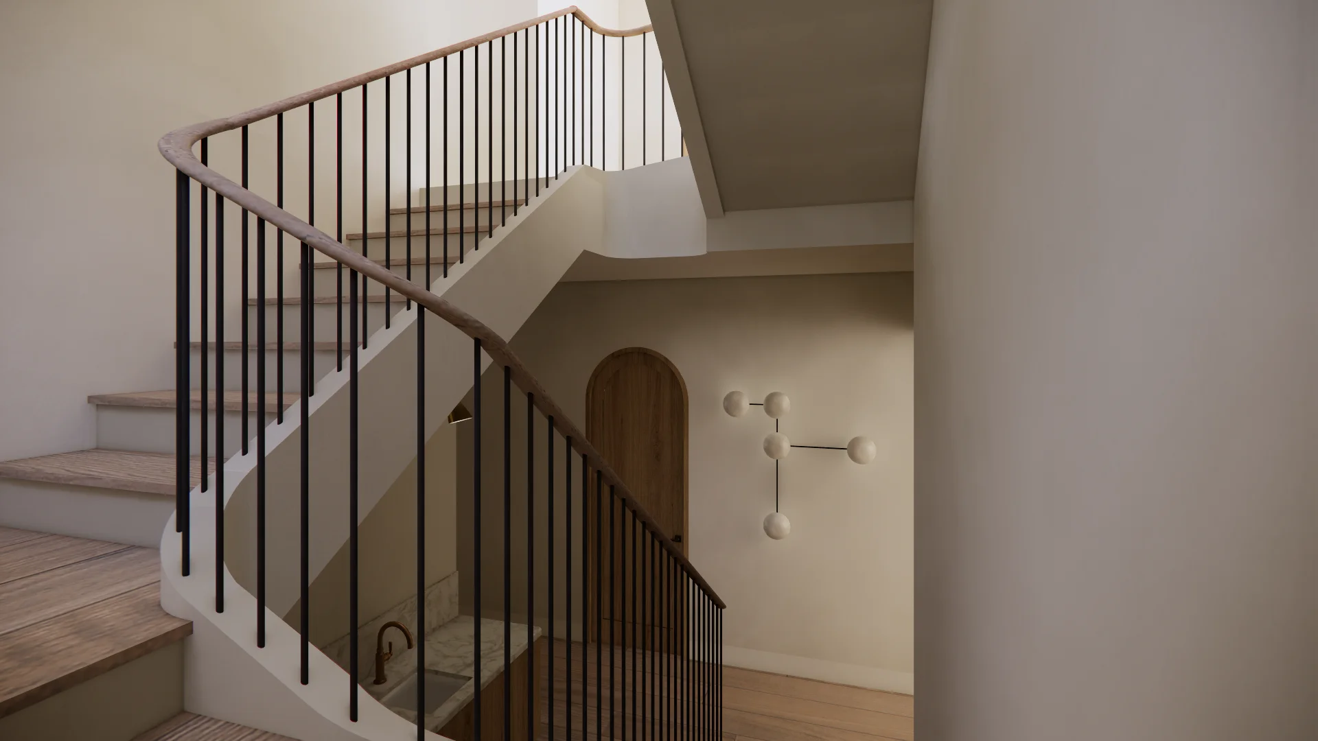A modern staircase with clean minimalist design features white-painted walls, light wood steps, and a curved wooden handrail paired with thin black vertical balusters that create striking geometric lines. The bright, neutral-toned space is accented with a sculptural wall-mounted light fixture made of spheres and an arched doorway.
