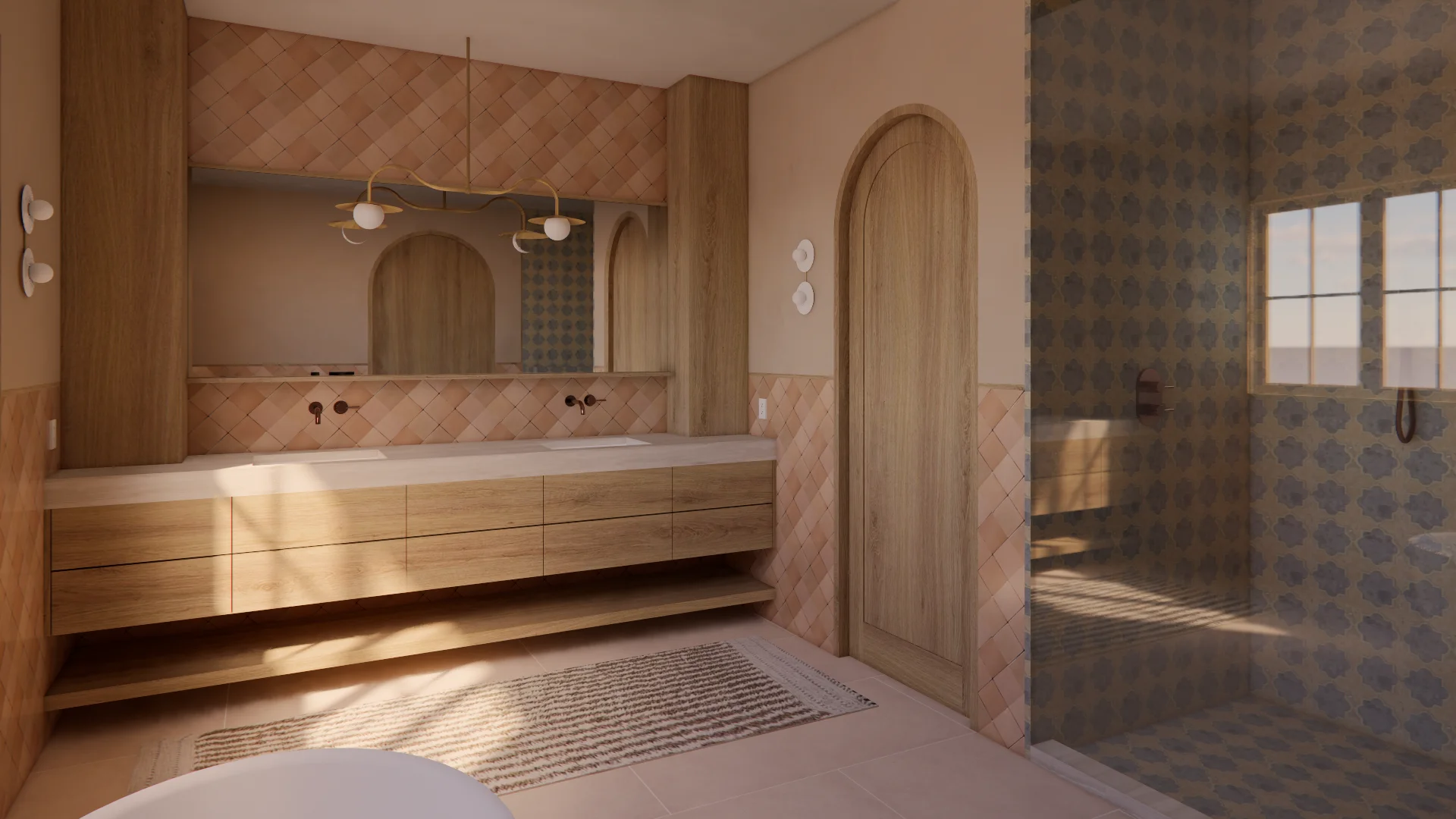 A warm, contemporary bathroom features a floating wooden vanity with dual sinks beneath arched mirrors, complemented by a diamond-patterned tile backsplash in soft pink tones and warm wood cabinetry. Sunlight streams through a gridded window onto a patterned floor mat, while a frameless glass shower enclosure with dark tile accents occupies the right side of the space.